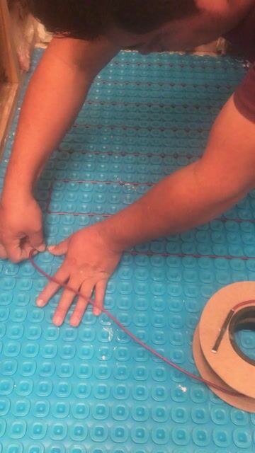 Installing Tempzone cable over uncoupling membrane 2