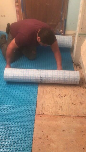 Cutting Uncoupling membrane over subfloor